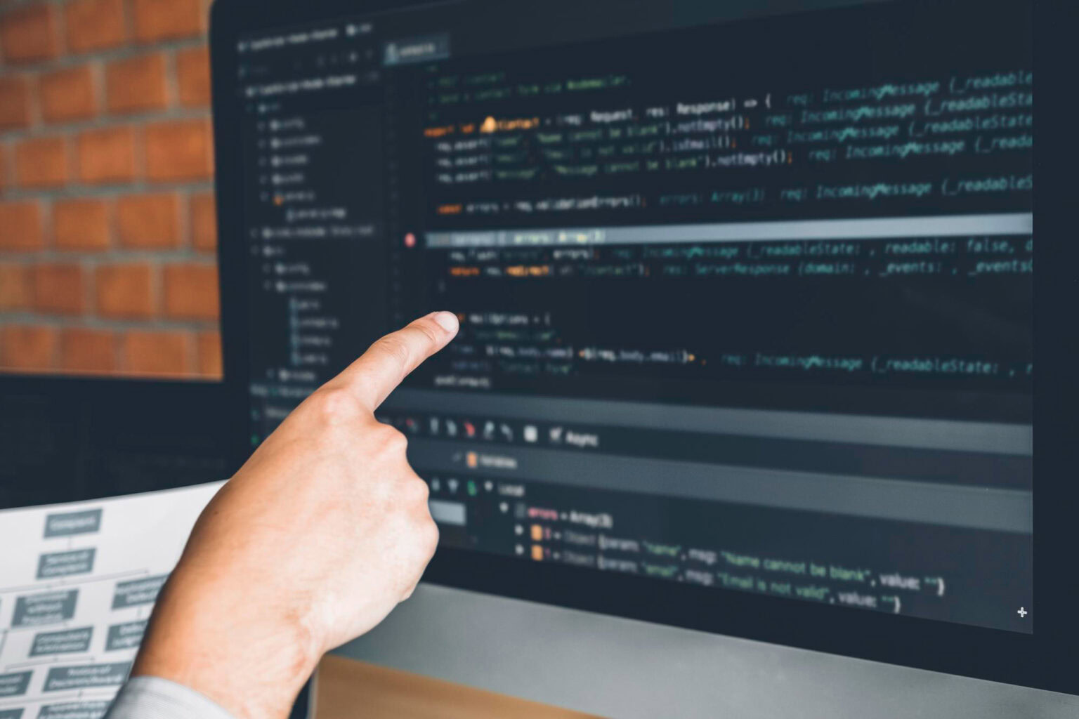 A developer points to an error in the browser